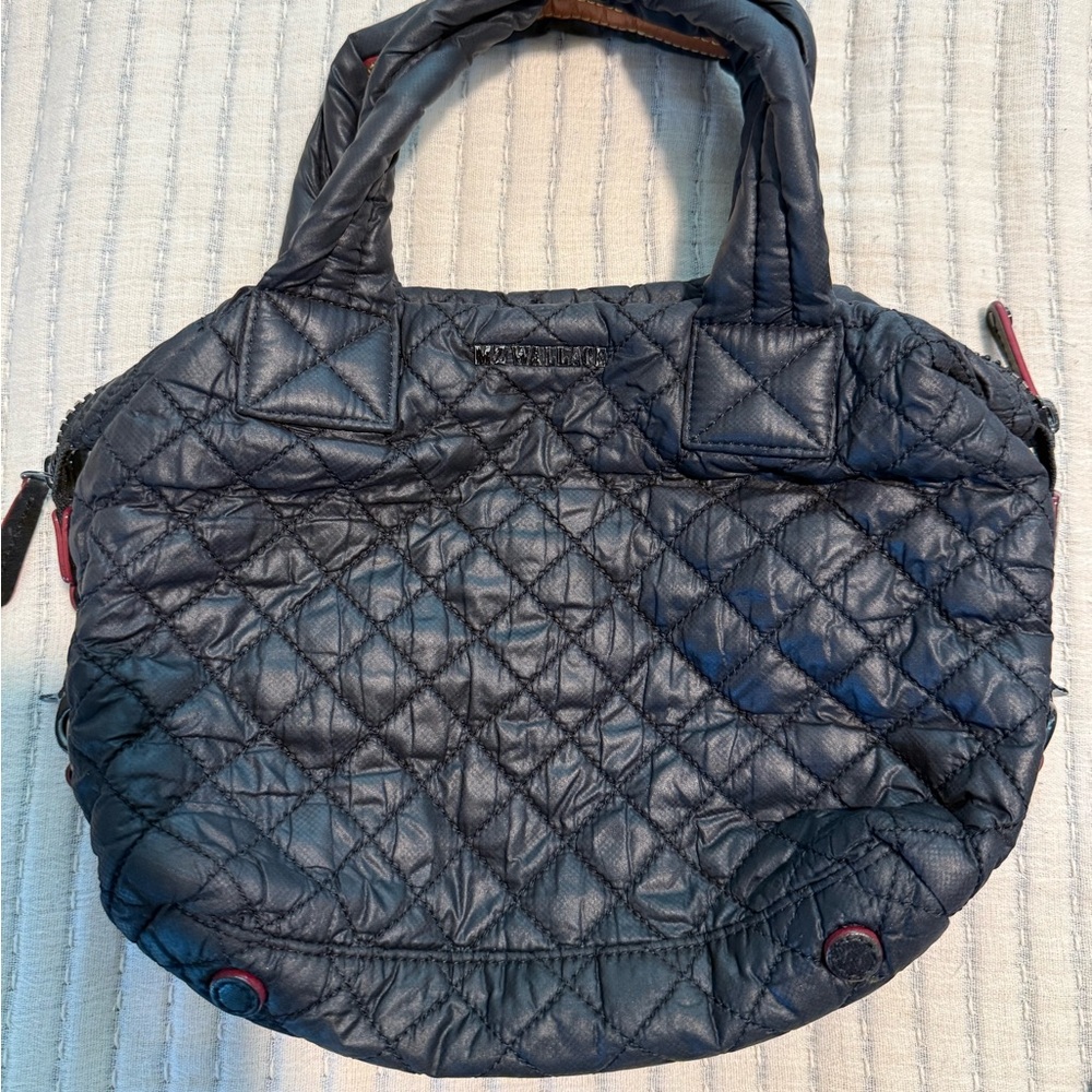 Well loved, used Small nylon black Sutton with strap. Approx 5x10 inches